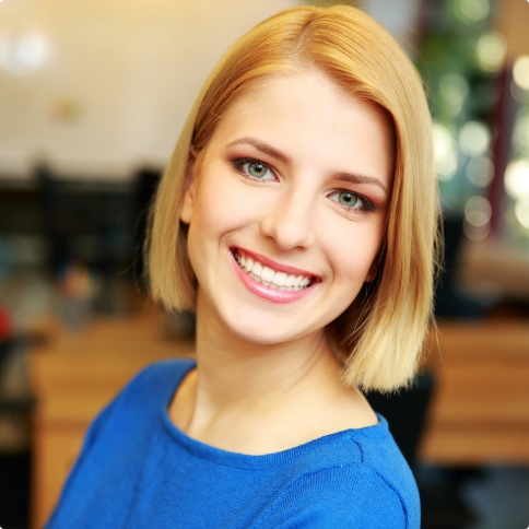 Smiling woman with chin length blonde hair