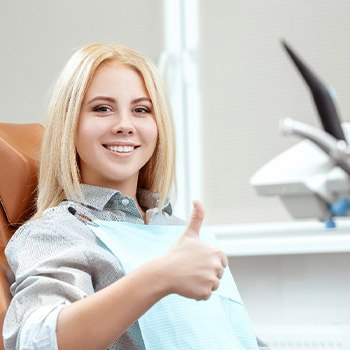 a patient smiling during a dental visit