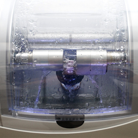 Milling machine in a dental office creating a dental crown