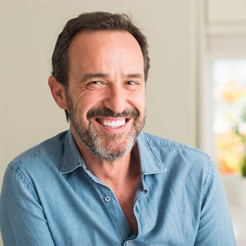 Smiling man in a denim shirt