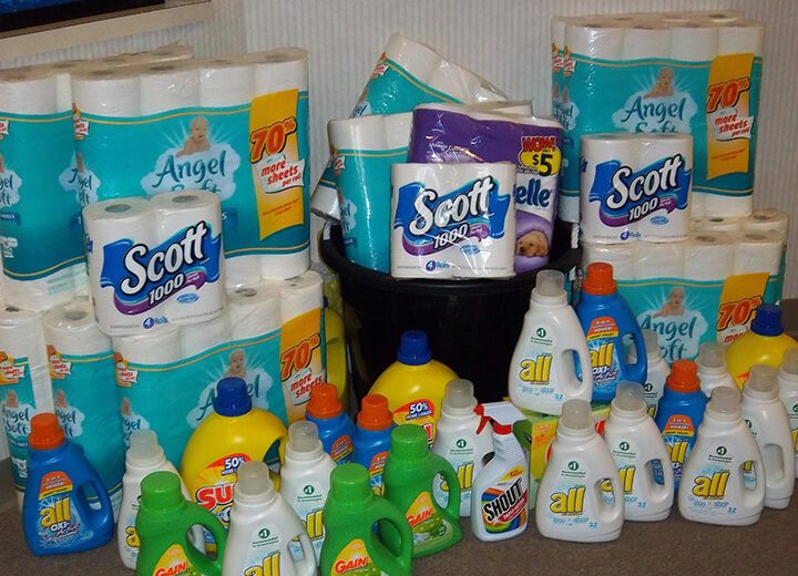 Large pile of donated cleaning supplies and toiletries