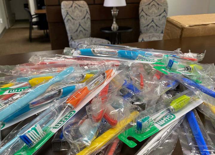 Pile of toothbrush packages on table