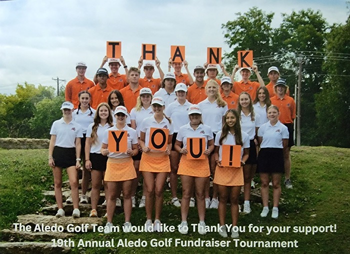 Aledo Golf Team with some members holding paper signs reading thank you