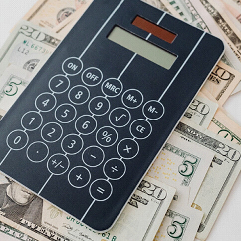 calculator and cash on white background