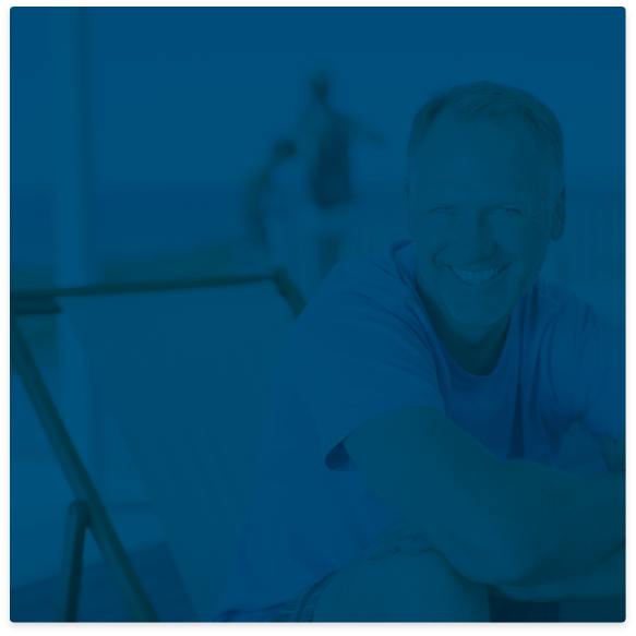 Smiling man sitting in dental chair