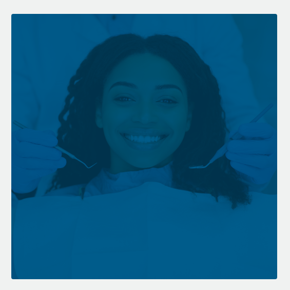 Smiling man sitting in dental chair