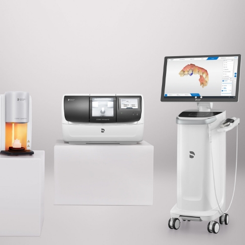Dental team member placing pulse oximeter on finger of patient