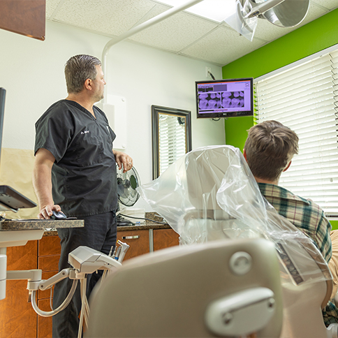 Weatherford dentist showing a patient x rays of their teeth