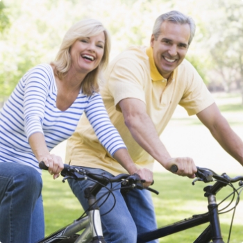 Man and woman riding bikes together