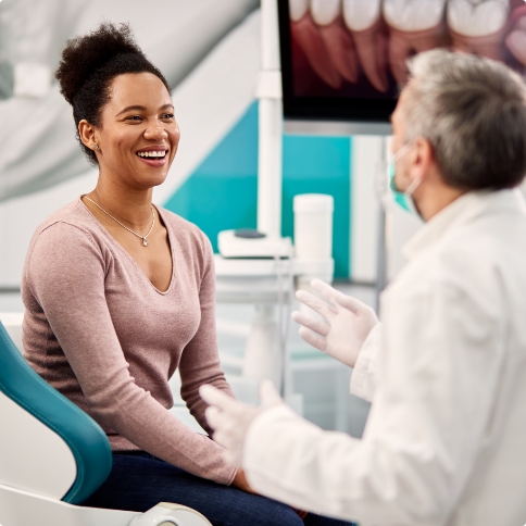 Woman smiling while visiting Weatherford dental office