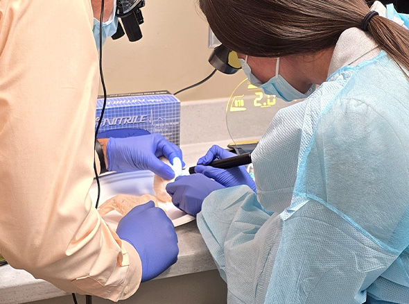 Dr. Decker working with another team member