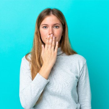 woman covering her mouth