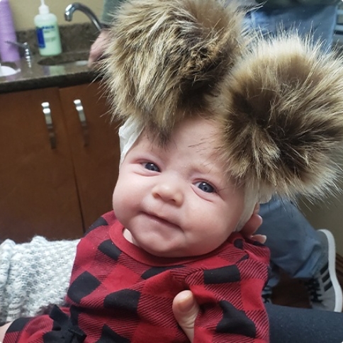 Baby with poofy hair in childrens dental office in Weatherford