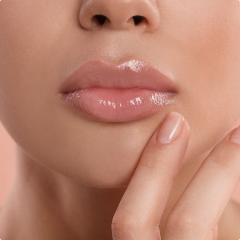 Close up of a person touching their chin with their hand