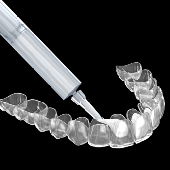 Bleaching gel being applied to the inside of teeth whitening tray