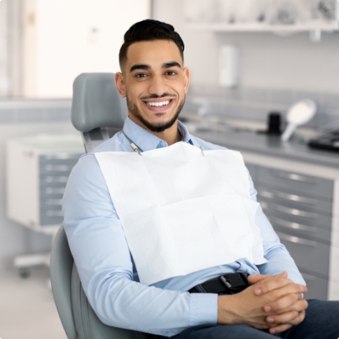 Smiling man in dental chair