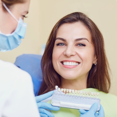 Smiling woman at veneers consultation