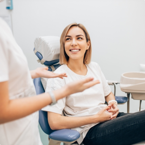 Woman listening to her cosmetic dentist talk