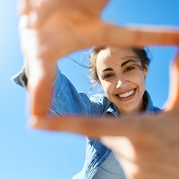 Woman smiling outdoors in the sun