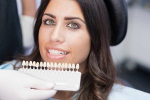 A woman choosing porcelain veneers.