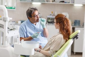 woman talking to dentist 