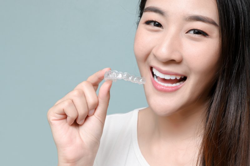 person inserting clear aligners