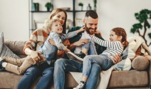 Smiling Family at Home After Seeing Dentist in Weatherford