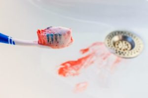 A toothbrush with blood on it